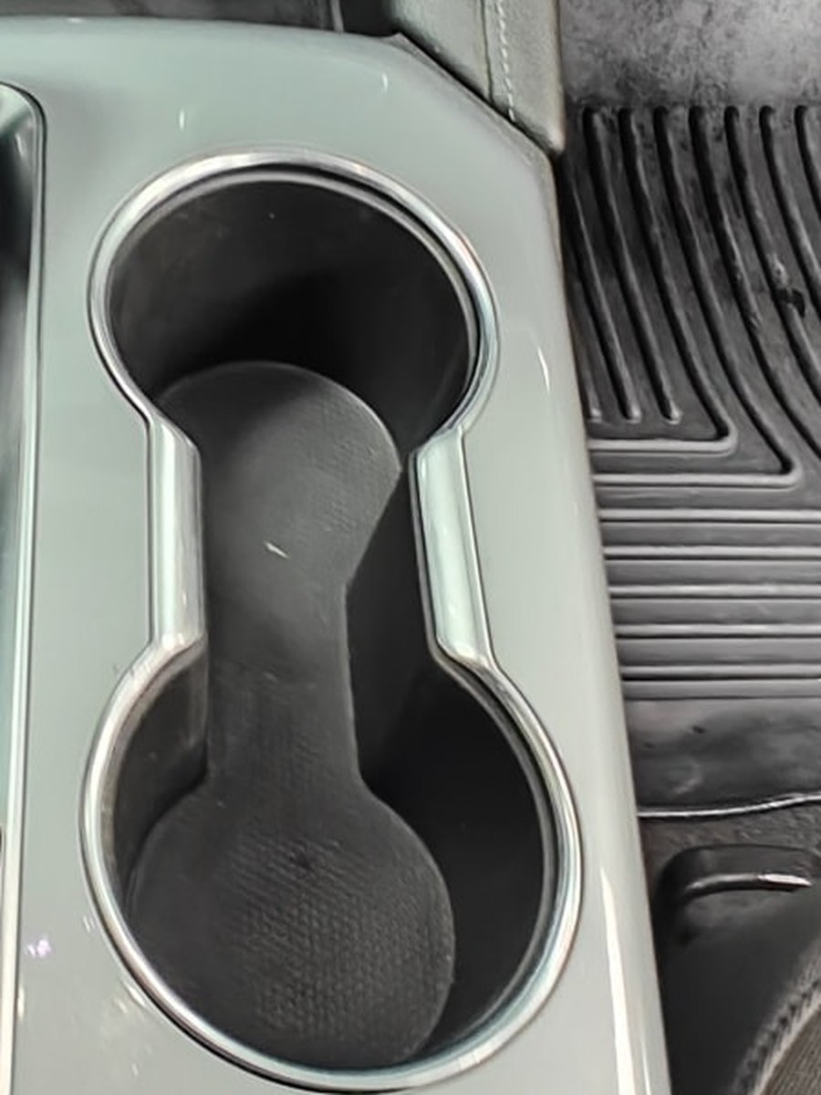 Center console cup holders after Drip Detail Co. cleaning, spotless and like new
